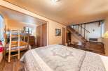 This charming bedroom features a cozy bunk bed setup, perfect for families or groups.