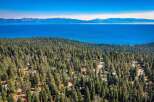 Experience breathtaking views of Lake Tahoe from this stunning property nestled amidst a dense pine forest.