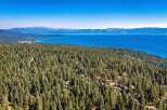 Experience breathtaking views of Lake Tahoe from this stunning property nestled amidst a lush pine forest.
