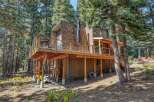 Experience the charm of this rustic mountain home, nestled amongst towering pine trees.