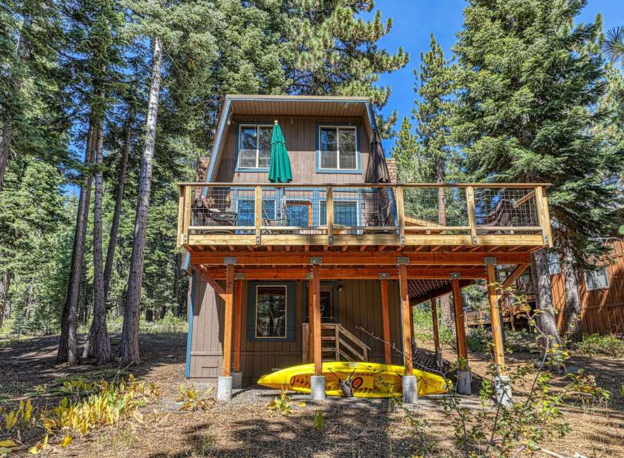Experience the perfect mountain getaway in this charming cabin nestled among tall pine trees.