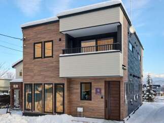 Experience modern living in this stunning multi-story home, perfect for a snowy retreat.