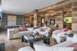 Experience rustic luxury in this mountain retreat, featuring a spacious living area with a pool table and pinball machine for entertainment.