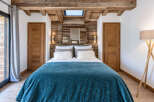 Experience rustic charm and modern comfort in this beautifully appointed bedroom.