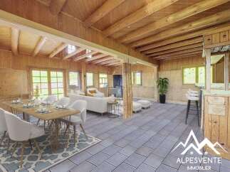 Experience the charm of this rustic mountain retreat, featuring a spacious open-plan living area with a cozy dining space and a fully equipped bar.