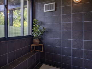 Experience tranquility in this modern bathroom, featuring a spacious bathtub perfect for unwinding.