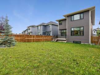 Discover this spacious backyard, perfect for outdoor living and entertaining.