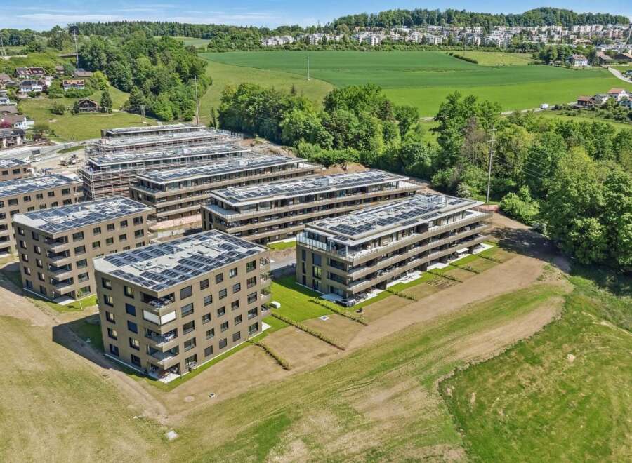 Discover modern living in this new construction development, featuring multiple apartment buildings with sleek, contemporary architecture.