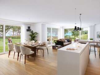 Experience modern living in this open-concept home, featuring a spacious dining area, a comfortable living room, and a sleek kitchen island.