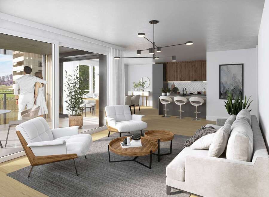Experience modern living in this open-concept condo, featuring a sleek kitchen with a breakfast bar and a spacious living area.