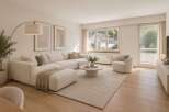 Step into this beautifully appointed living room, featuring a spacious, modular sectional sofa in a neutral tone, perfect for relaxation and entertaining.