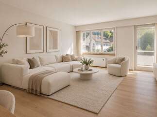 Step into this beautifully appointed living room, featuring a spacious, modular sectional sofa in a neutral tone, perfect for relaxation and entertaining.