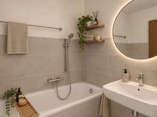 Experience modern comfort in this beautifully appointed bathroom, featuring a sleek bathtub and a stylish vanity with a large, illuminated mirror.