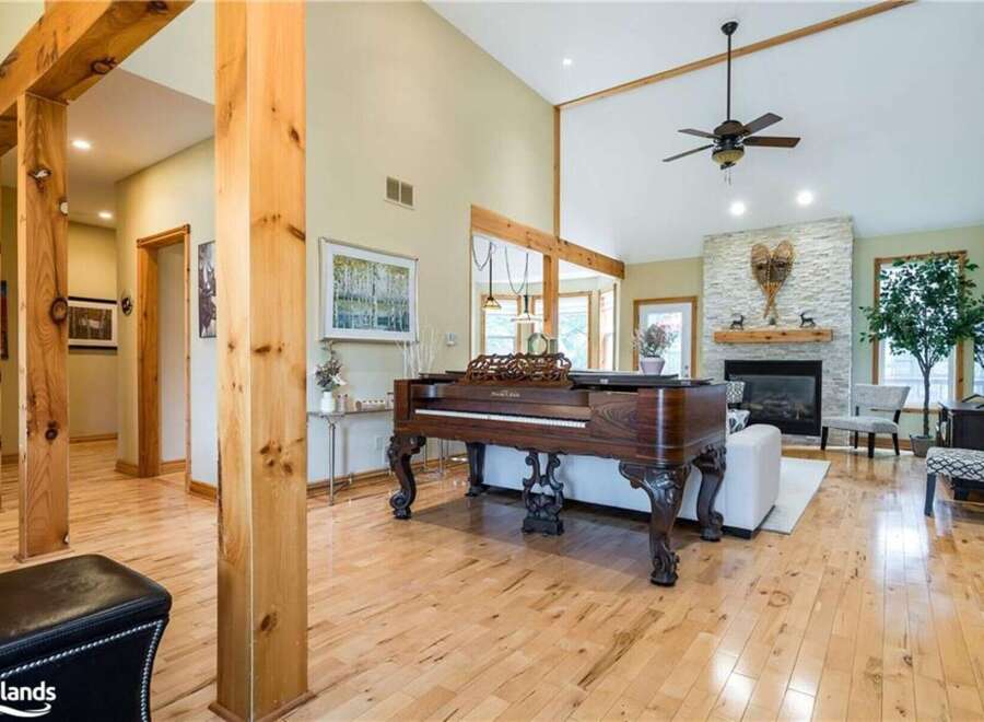 Step into this stunning home featuring a grand piano as the centerpiece of the living area, perfect for entertaining guests.
