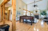 Step into this stunning home featuring a grand piano as the centerpiece of the living area, perfect for entertaining guests.