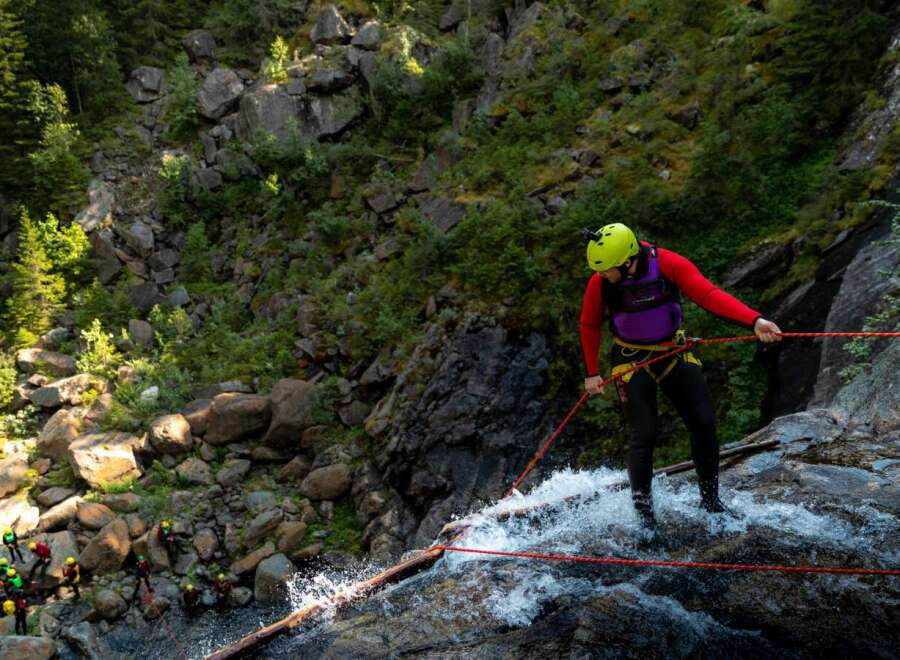 Experience the thrill of rappelling down a stunning waterfall in this breathtaking natural landscape.
