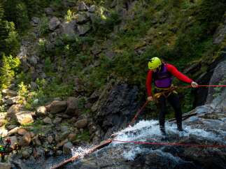Experience the thrill of rappelling down a stunning waterfall in this breathtaking natural landscape.