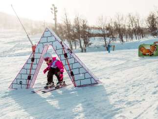 Experience the joy of winter sports with this charming ski slope designed for young adventurers.