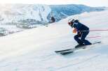 Experience the thrill of skiing down pristine slopes with breathtaking mountain views.