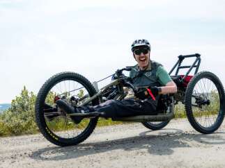 Experience the thrill of off-road adventure with this specialized handcycle, perfect for exploring rugged terrains.