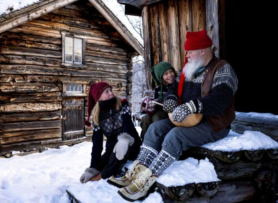 Experience the charm of a rustic log cabin nestled in a snowy landscape, perfect for a cozy winter retreat.