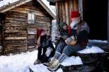 Experience the charm of a rustic log cabin nestled in a snowy landscape, perfect for a cozy winter retreat.