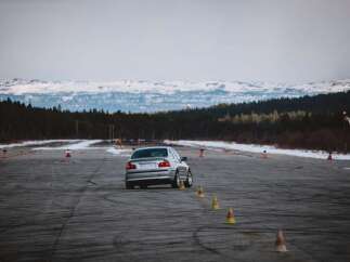 Experience the thrill of driving on this expansive asphalt track, perfect for performance driving events or personal practice.