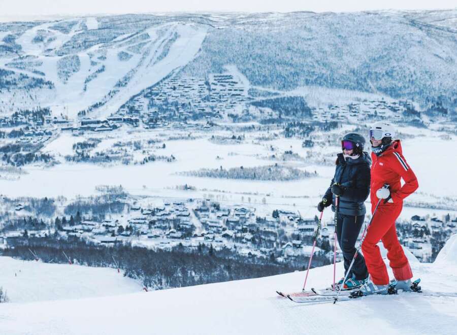 Experience the ultimate winter getaway with this stunning ski resort property offering breathtaking panoramic views of snow-capped mountains and a charming village nestled below.