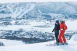 Experience the ultimate winter getaway with this stunning ski resort property offering breathtaking panoramic views of snow-capped mountains and a charming village nestled below.