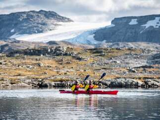 Experience the ultimate adventure with a kayaking trip through breathtaking glacial landscapes.