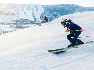 Experience the thrill of skiing down pristine slopes with breathtaking mountain views.