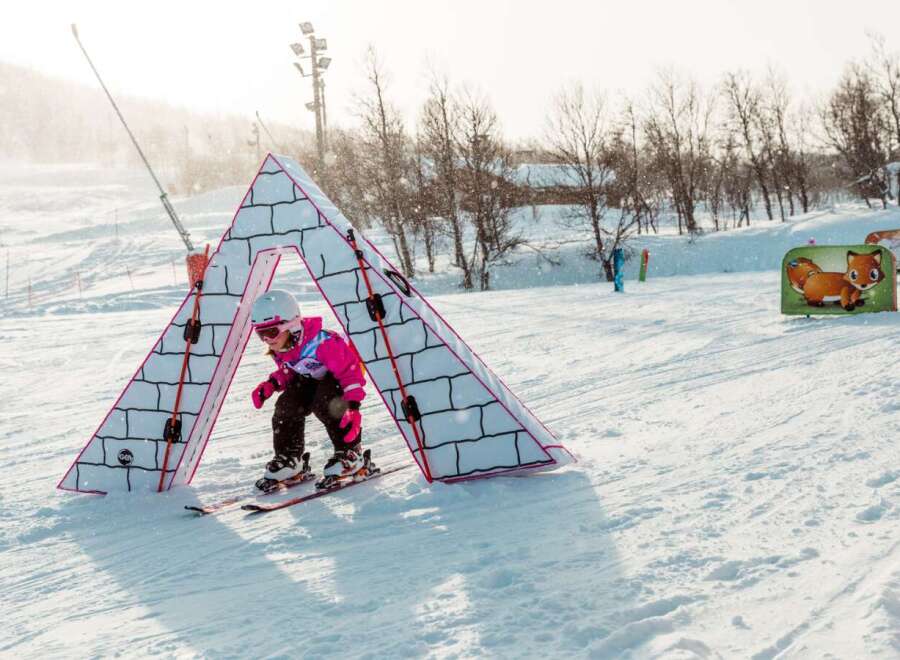 Experience the joy of winter sports with this charming ski slope designed for young adventurers.