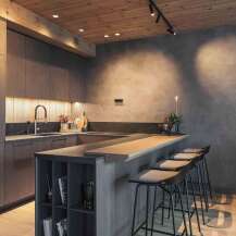 Experience modern living in this stunning kitchen featuring sleek, dark wood cabinetry and a spacious island with bar seating.