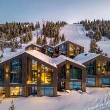Experience luxury mountain living in this stunning ski-in/ski-out property, nestled amidst snow-covered pines and overlooking pristine ski slopes.