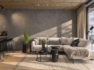 Experience modern mountain living in this stunning living room, featuring a plush sectional sofa adorned with decorative pillows and a cozy throw.