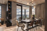 Experience luxury mountain living in this stunning dining area, featuring a sleek dark wood table surrounded by comfortable brown chairs, one adorned with a plush sheepskin throw.