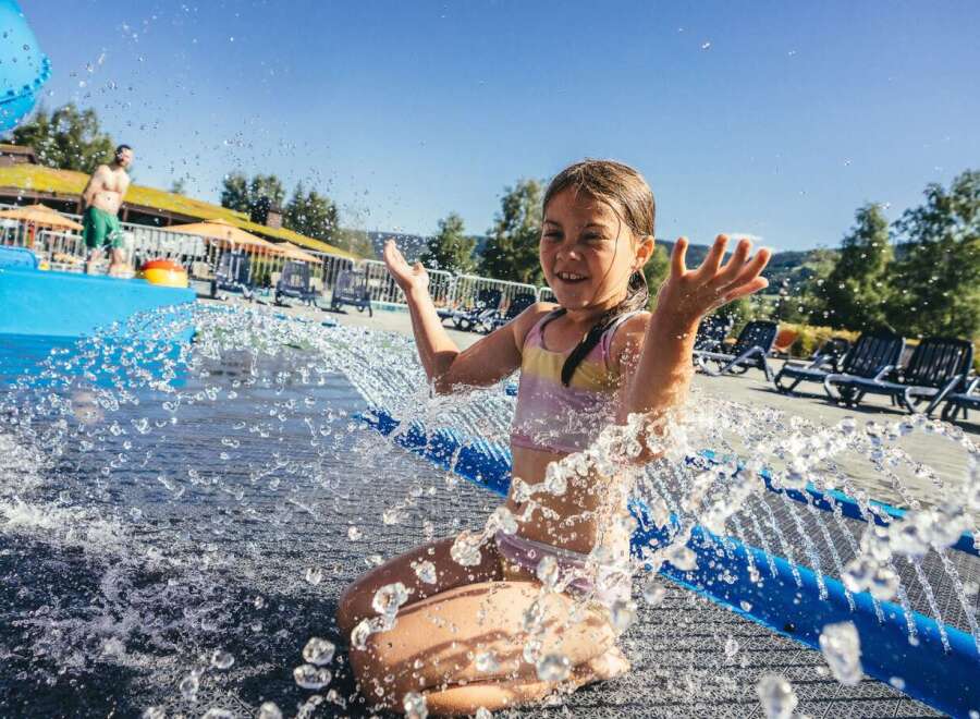 Enjoy a refreshing day at this water park, featuring a thrilling blue water slide perfect for all ages.