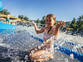 Enjoy a refreshing day at this water park, featuring a thrilling blue water slide perfect for all ages.