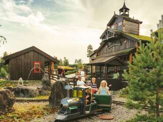 Experience the charm of this unique property, featuring rustic wooden architecture with living green roofs that blend seamlessly with the natural surroundings.