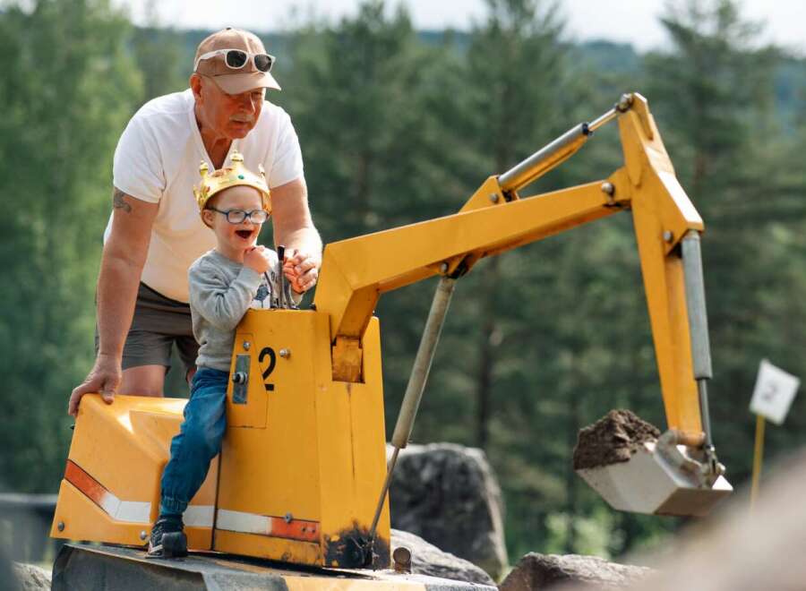 Experience the joy of outdoor play with this unique property featuring a miniature excavator, perfect for little adventurers.
