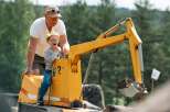 Experience the joy of outdoor play with this unique property featuring a miniature excavator, perfect for little adventurers.