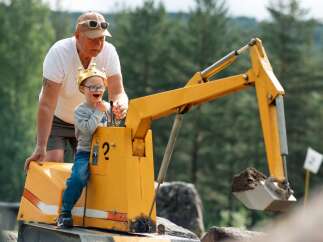 Experience the joy of outdoor play with this unique property featuring a miniature excavator, perfect for little adventurers.