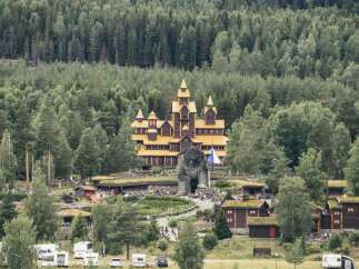 Discover a unique fairytale-like castle nestled amidst a lush, dense forest, offering a whimsical and enchanting atmosphere.