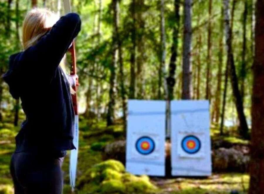 Experience the thrill of archery in a serene forest setting.