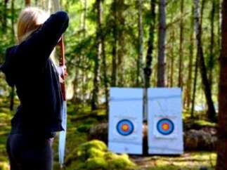 Experience the thrill of archery in a serene forest setting.