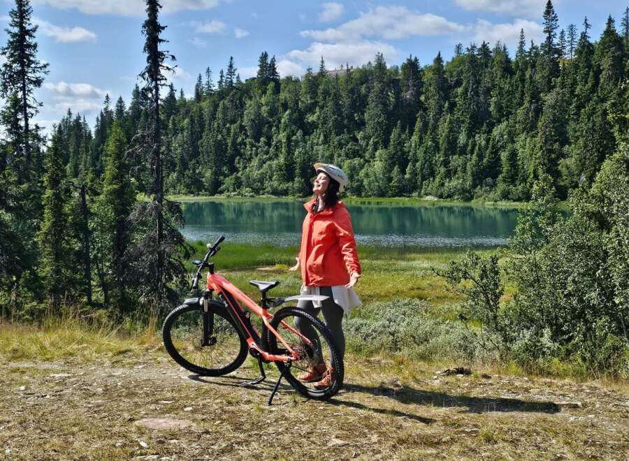 Experience the ultimate outdoor adventure with this stunning property, featuring a serene lake and lush forest backdrop perfect for cycling enthusiasts.