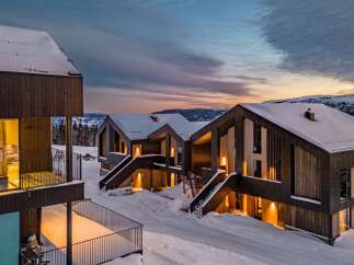 Experience modern luxury in this stunning ski-in/ski-out mountain retreat, featuring contemporary architecture and breathtaking panoramic views.