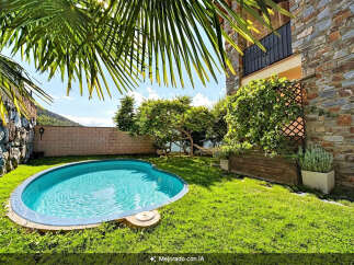 Escape to your private oasis with this charming backyard featuring a sparkling blue pool, perfect for refreshing dips on sunny days.