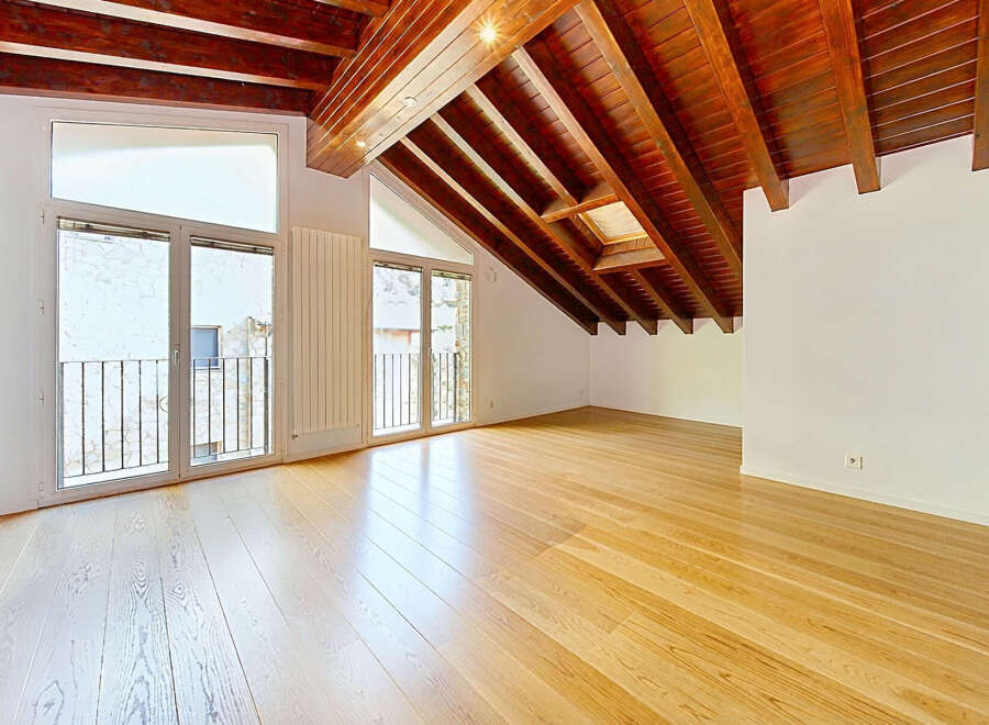 Experience the charm of this attic apartment, boasting a stunning vaulted wooden beam ceiling that adds warmth and character.