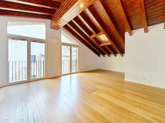 Experience the charm of this attic apartment, boasting a stunning vaulted wooden beam ceiling that adds warmth and character.